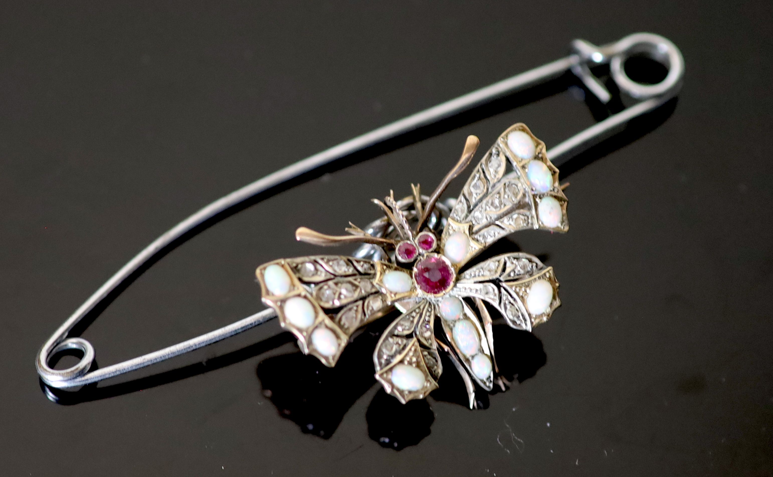 An Edwardian gold and silver, rose cut diamond, white opal and ruby set butterfly brooch,